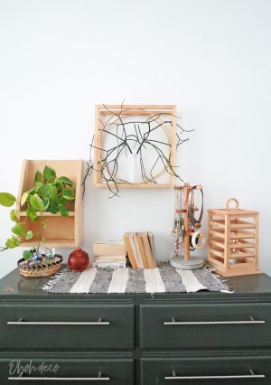 An easy DIY to build a geometric display shelf using embroidery loops and wood trim. #diyshelf #storage #displayshelf #wallshelf #homedecor #diy