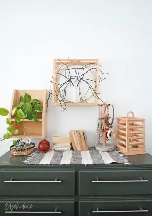 An easy DIY to build a geometric display shelf using embroidery loops and wood trim. #diyshelf #storage #displayshelf #wallshelf #homedecor #diy