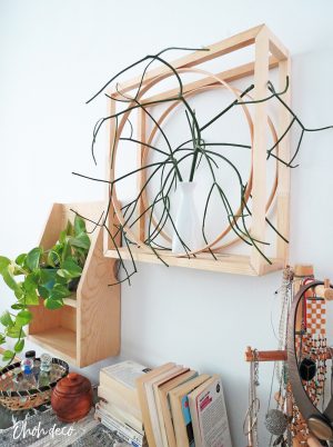 An easy DIY to build a geometric display shelf using embroidery loops and wood trim. #diyshelf #storage #displayshelf #wallshelf #homedecor #diy