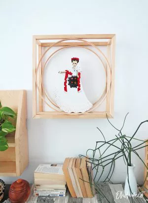 An easy DIY to build a geometric display shelf using embroidery loops and wood trim. #diyshelf #storage #displayshelf #wallshelf #homedecor #diy