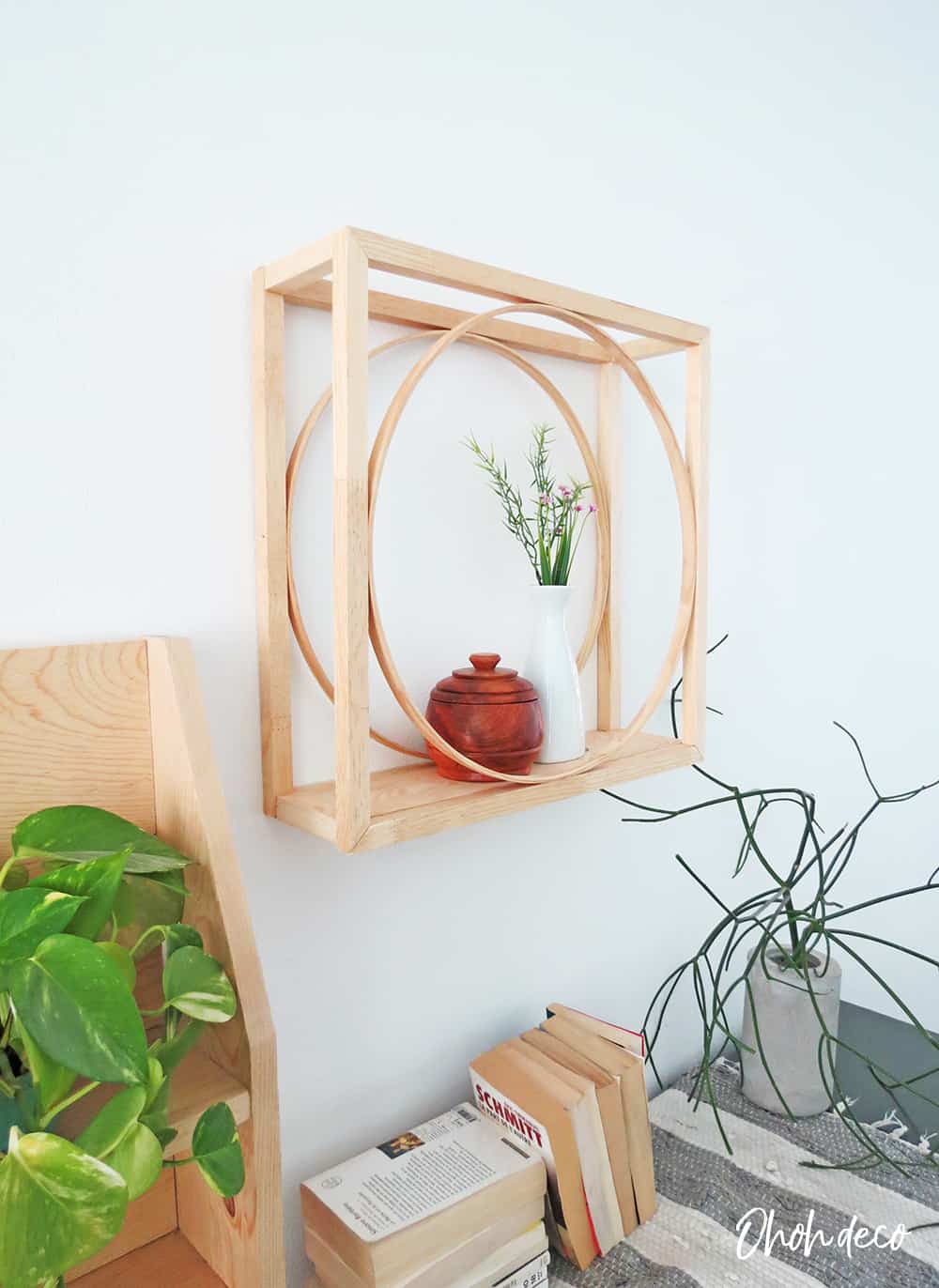 An easy DIY to build a geometric display shelf using embroidery loops and wood trim. #diyshelf #storage #displayshelf #wallshelf #homedecor #diy