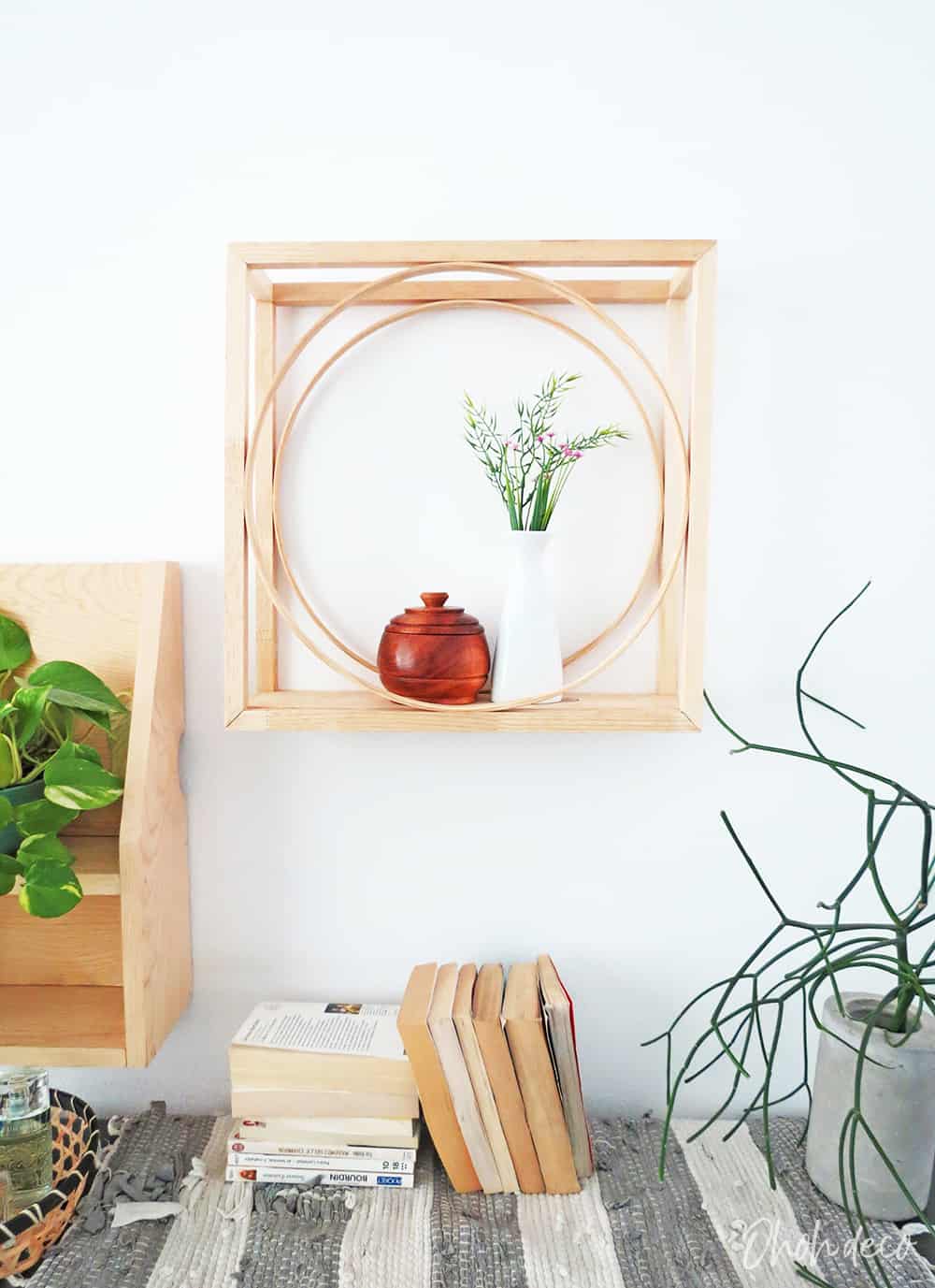 An easy DIY to build a geometric display shelf using embroidery loops and wood trim. #diyshelf #storage #displayshelf #wallshelf #homedecor #diy