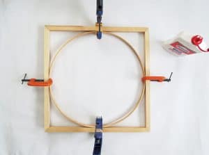 An easy DIY to build a geometric display shelf using embroidery loops and wood trim. #diyshelf #storage #displayshelf #wallshelf #homedecor #diy