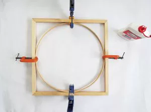 An easy DIY to build a geometric display shelf using embroidery loops and wood trim. #diyshelf #storage #displayshelf #wallshelf #homedecor #diy