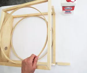 An easy DIY to build a geometric display shelf using embroidery loops and wood trim. #diyshelf #storage #displayshelf #wallshelf #homedecor #diy