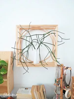 An easy DIY to build a geometric display shelf using embroidery loops and wood trim. #diyshelf #storage #displayshelf #wallshelf #homedecor #diy