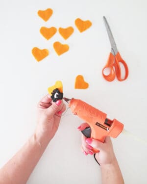 DIY yarn wall hanging with felt flowers