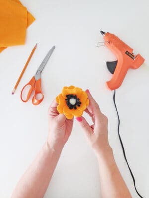 DIY yarn wall hanging with felt flowers