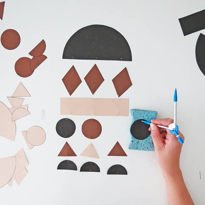 punch holes into paper shapes