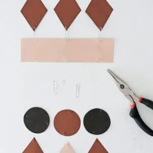 attach shapes to make paper wall hanging