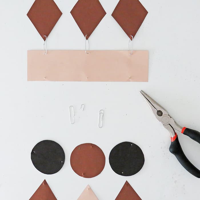 attach shapes to make paper wall hanging