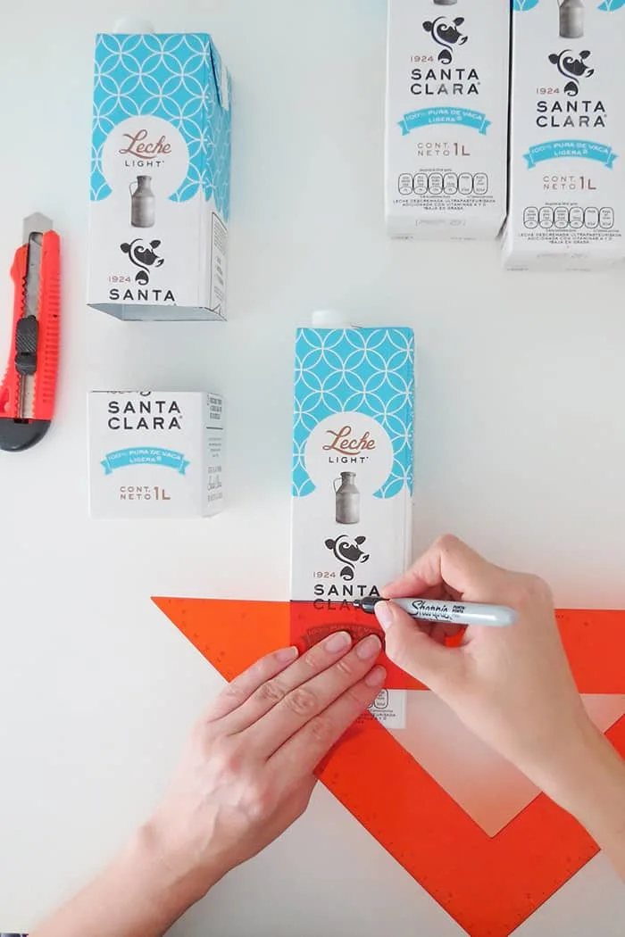 cut the bottom of the milk container to make the desk organizer