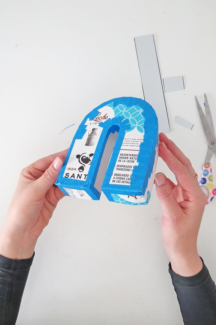 Tape the cradboard together to make the phone stand