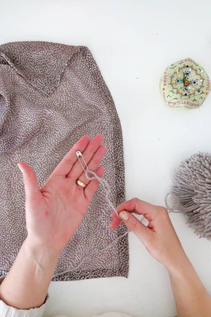 how to attach a pom pom to a scarf