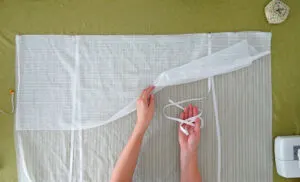 place ribbon to make tie-up shade