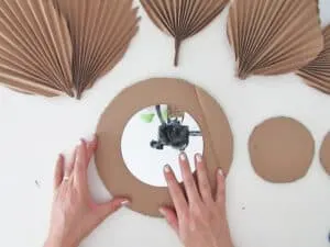 cut cardboard circle to make DIY mirror