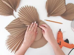 glue leaves to make DIY mirror