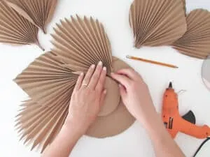 glue leaves to make DIY mirror