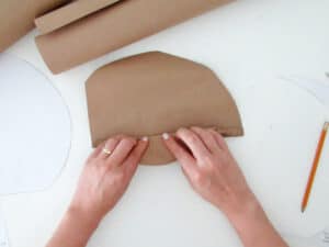 fold palm leaf to make DIY mirror