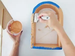 apply paint on add cardboard layers to diy wall shelf
