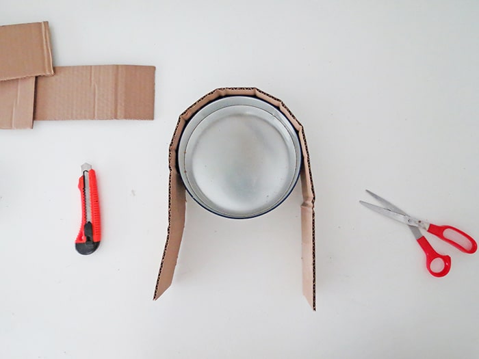 wrap cardboard around the box to make diy wall shelf