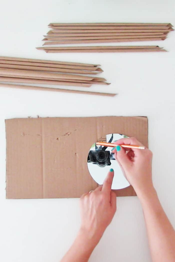 cut the cardboard to make the wall mirror