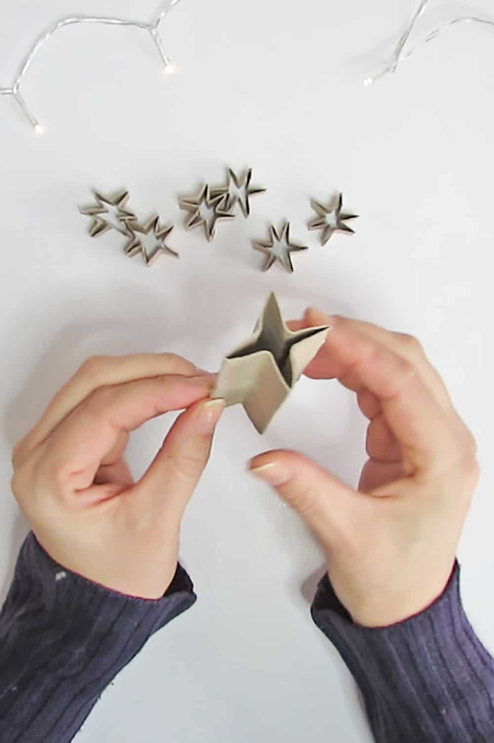 press the cardboard to make the star