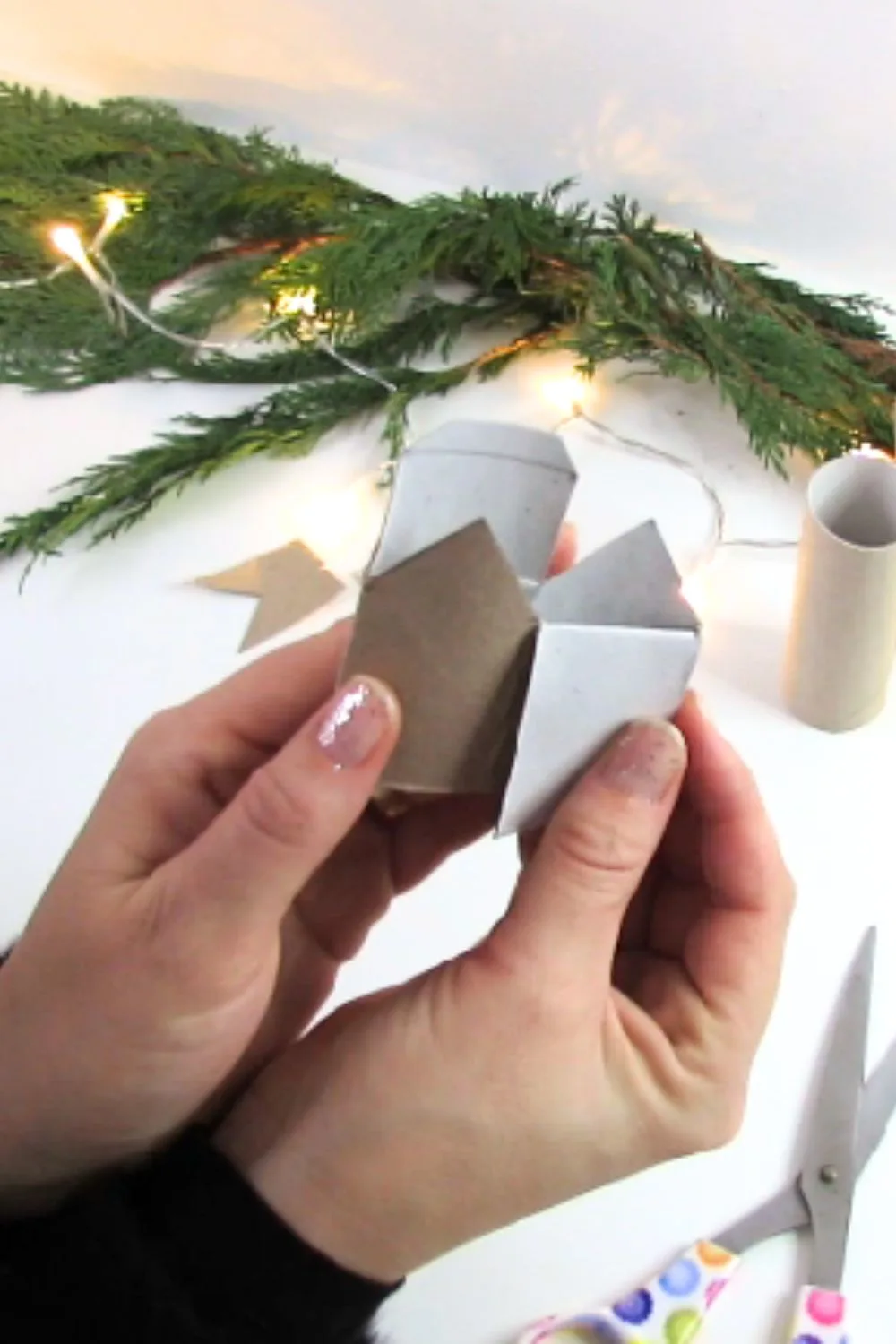 make a house out of toilet paper rolls