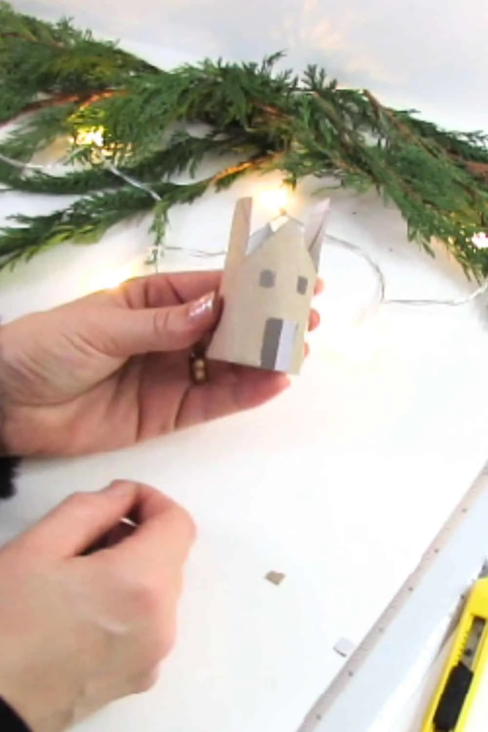 cut window and door in the cardboard house