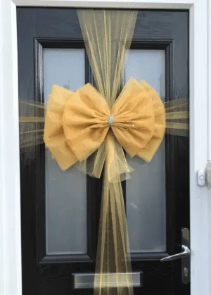 gold christmas bow for door
