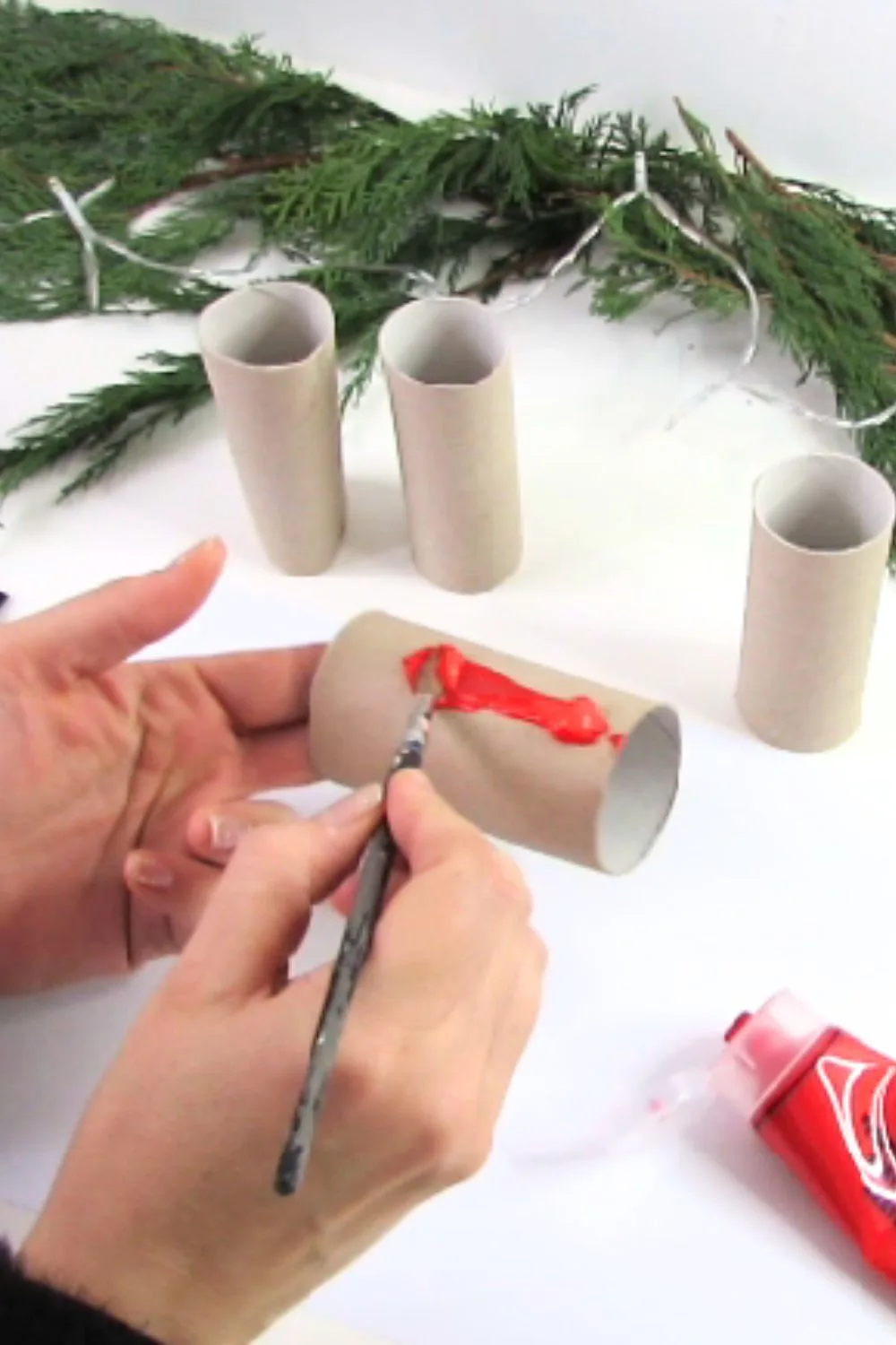 Paint the toilet paper rolls