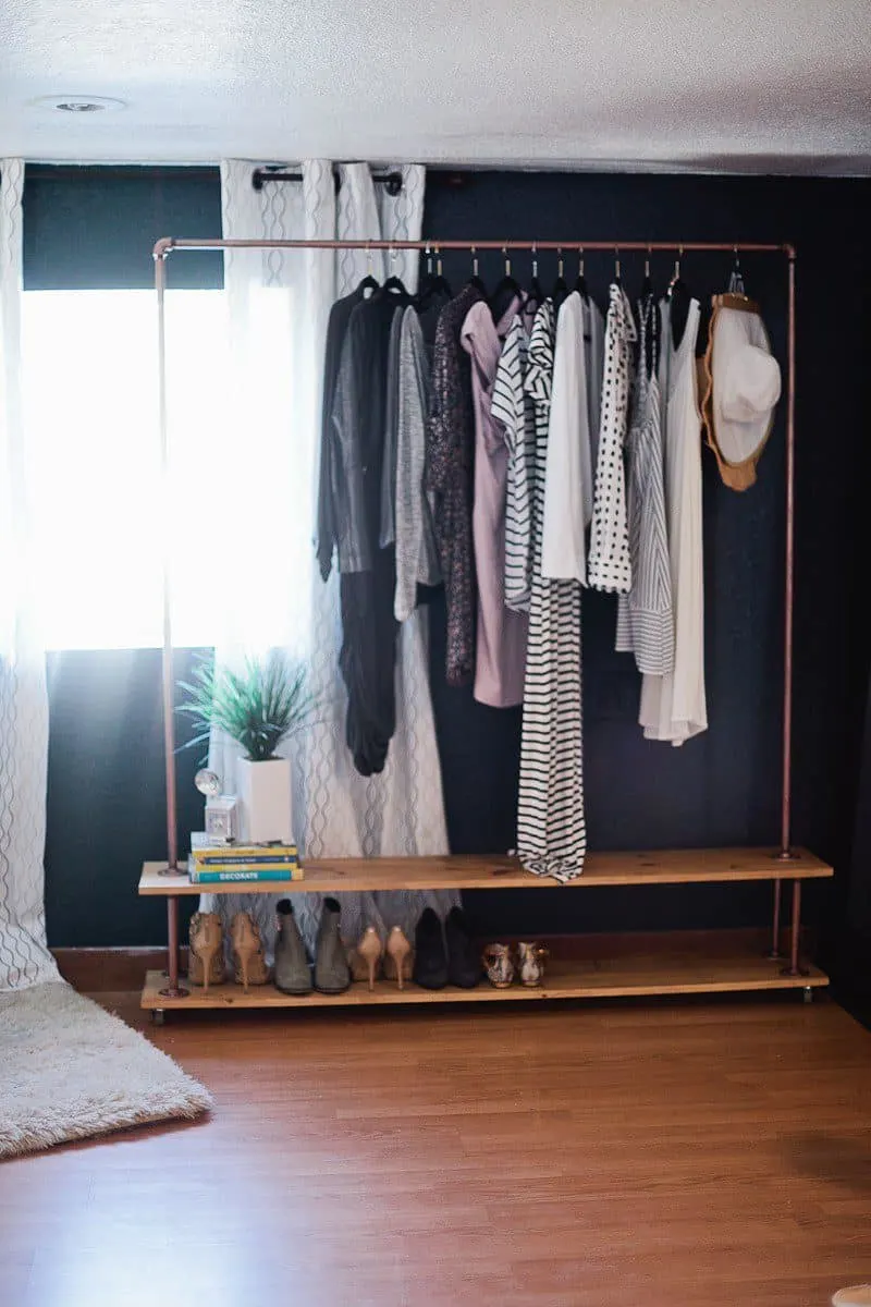 No closet? No problem. Create a DIY garment rack to take care of all of your clothes! This tutorial even shows how to add an extra shelf for storage and shoes!