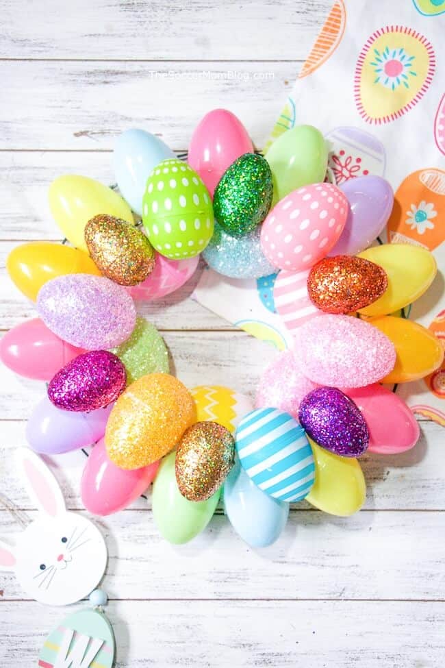 A quick & easy Easter Egg Wreath that anyone can make! Add a festive touch of Spring to your front doors in minutes with two different versions of this Easter craft.