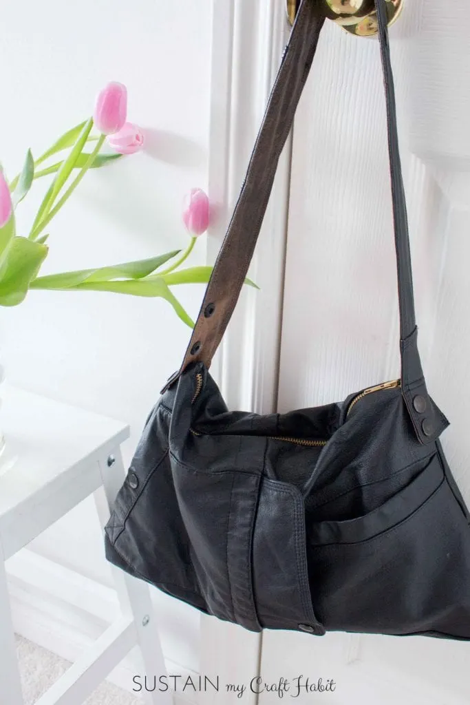 A dated leather jacket gets a new purpose in life as a useful, edgy and beautiful new DIY bag. This one-of-a-kind upcycled handbag is a great weekend sewing project. The detailed step-by-step tutorial is included.