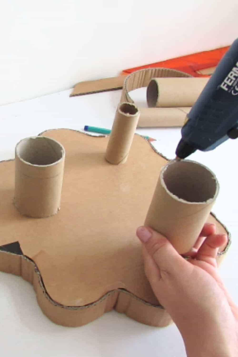 glue the cardboard tube to make the feet of the tiered tray