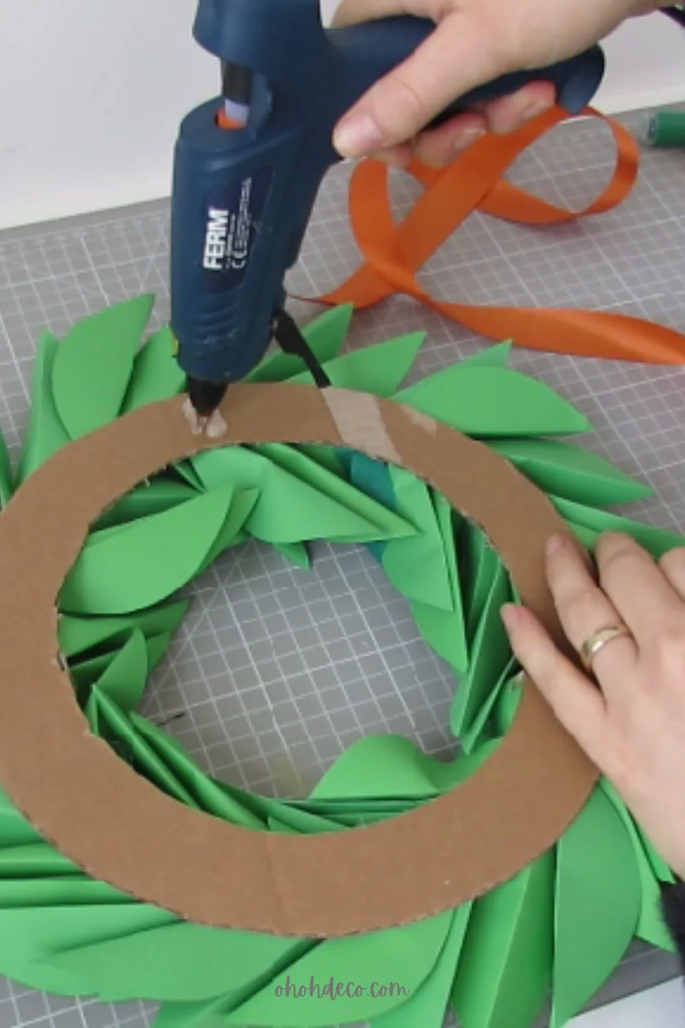glue the ribbon to hang the paper wreath