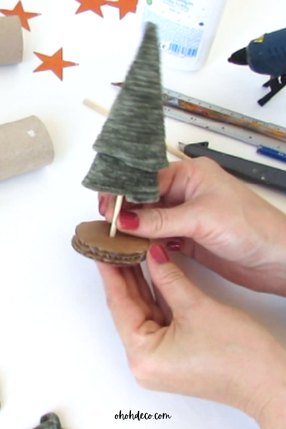 stick the christmas tree on the base