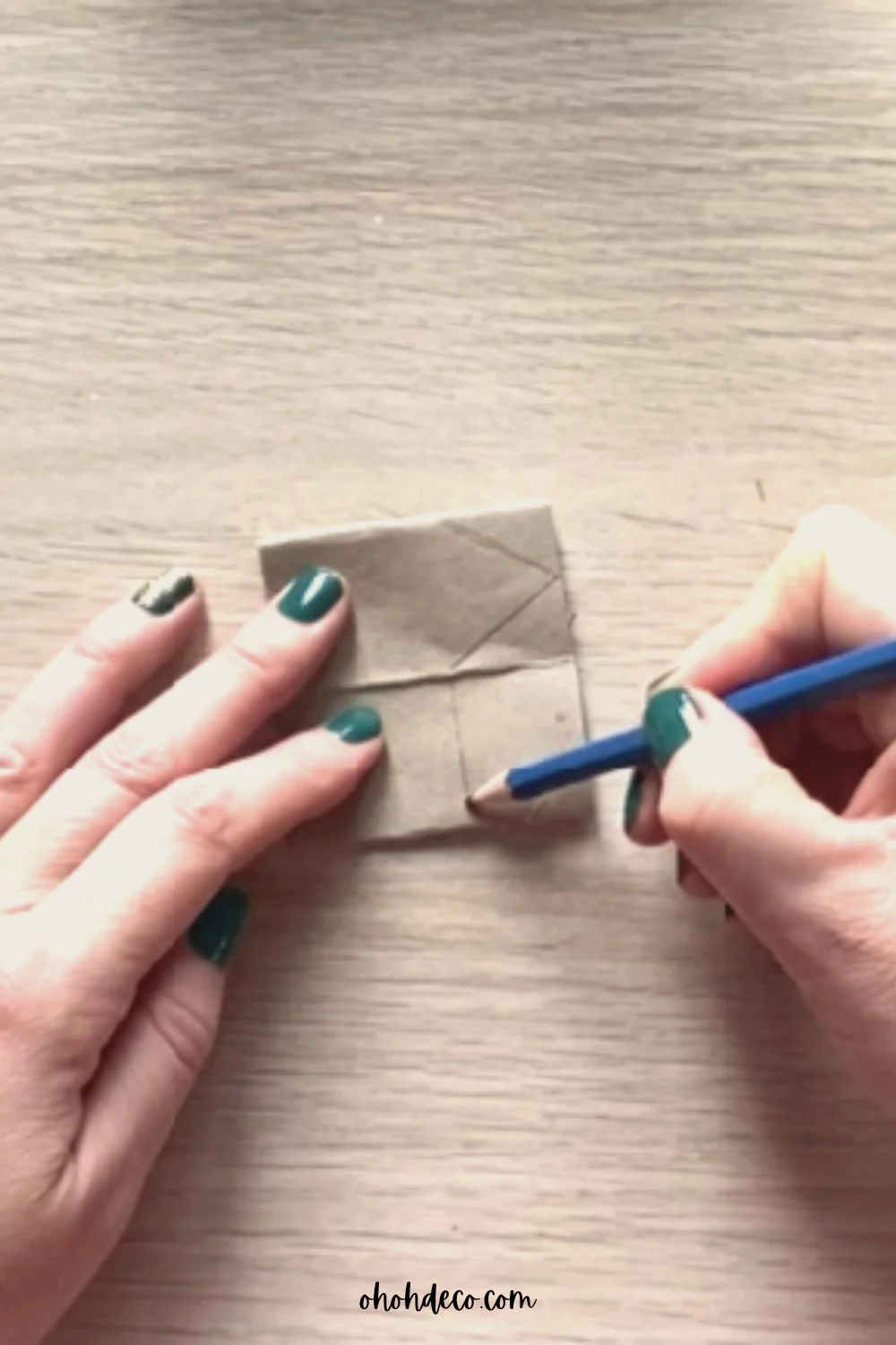 draw house shape on cardboard roll