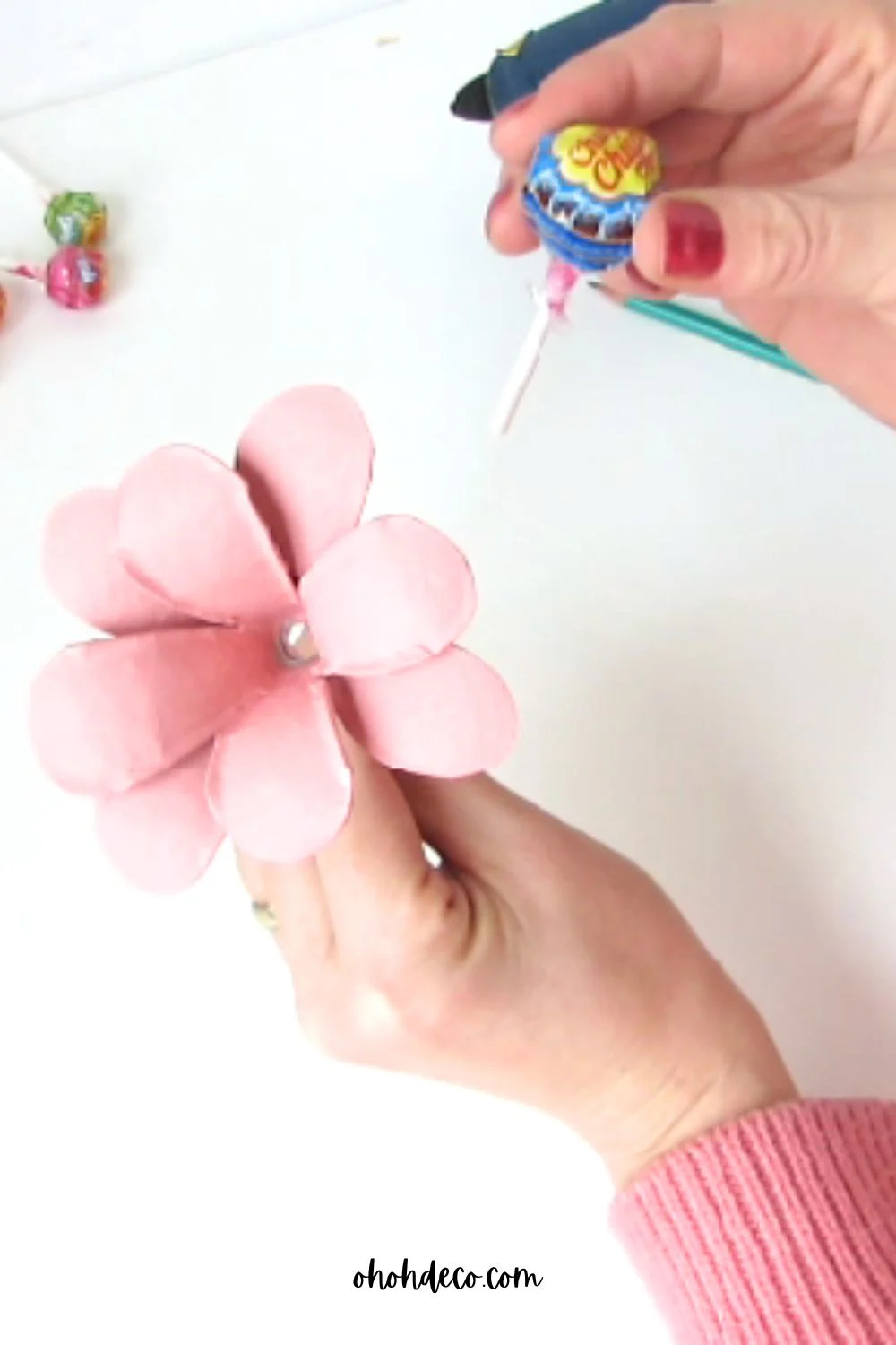 put the lollipop in the flower