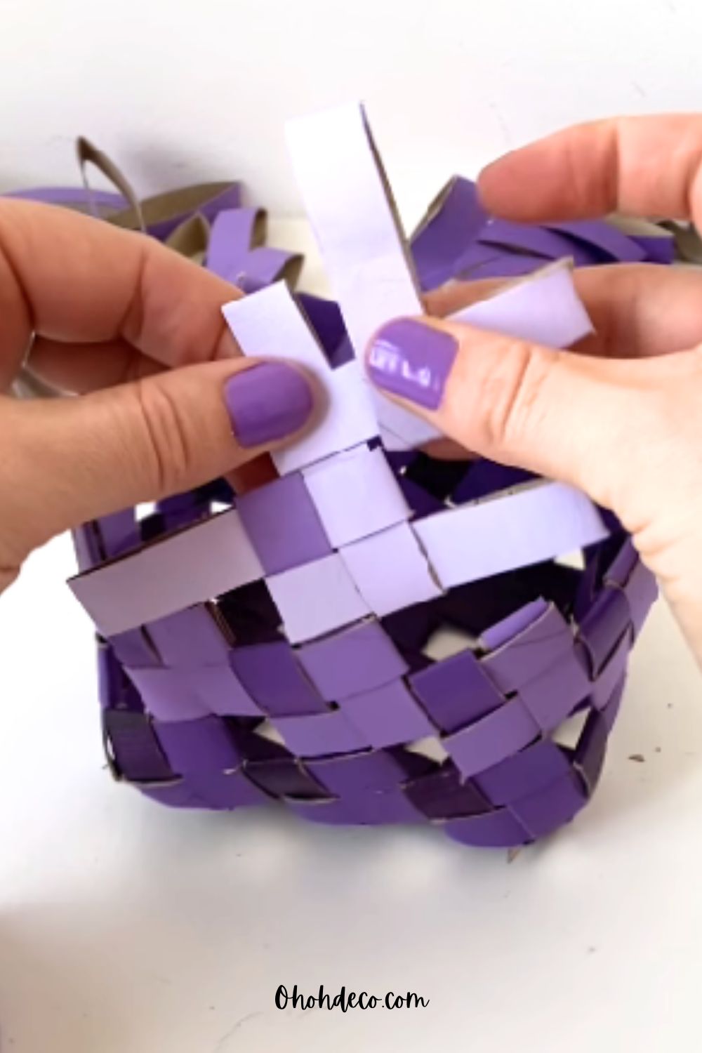 make the handle of the toilet paper roll basket